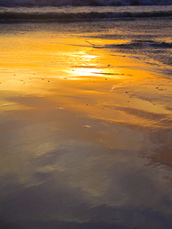 Sunset Reflected In Wet Sand